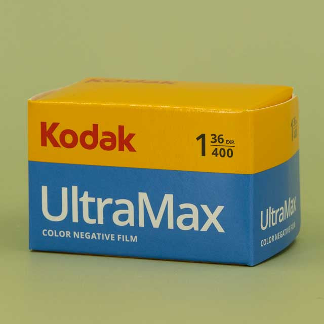 Kodak UltraMax color negative film packaging on a green background