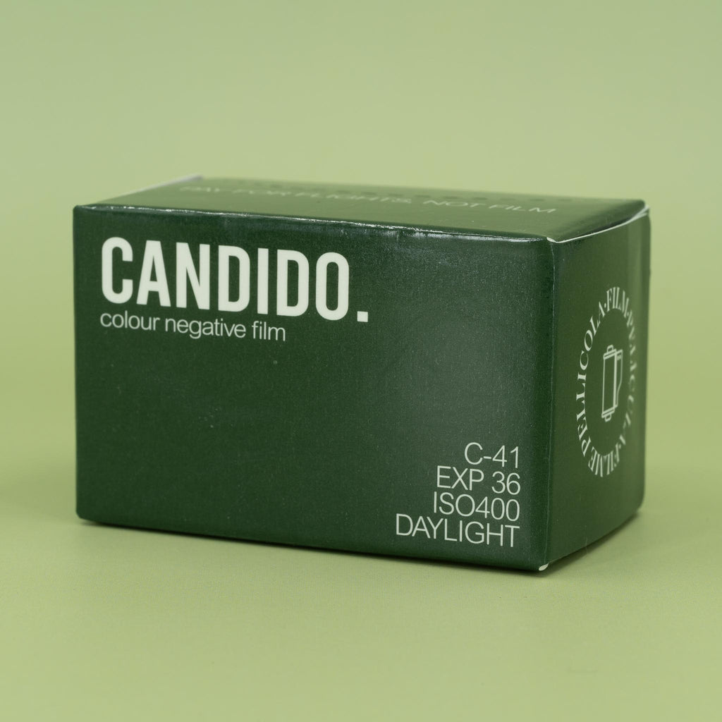 Candido 400 35mm film packaging on a green background
