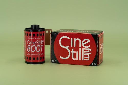 CineStill 800T film canister and box on a green background