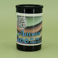 Flic Film Aurora canister on a green background