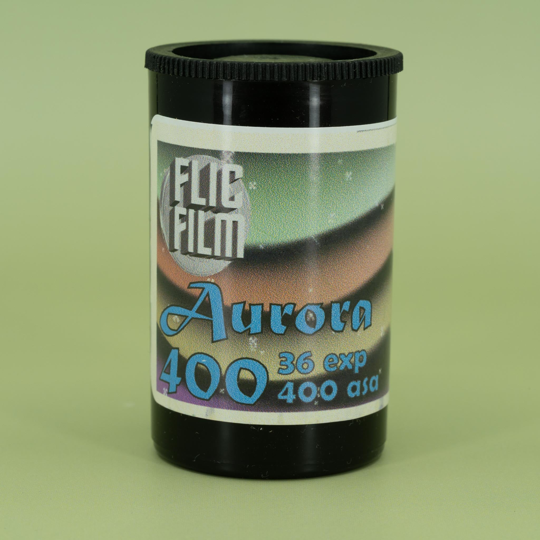 Flic Film Aurora canister on a green background