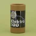Flic Film Elektra 100 film canister on a green background