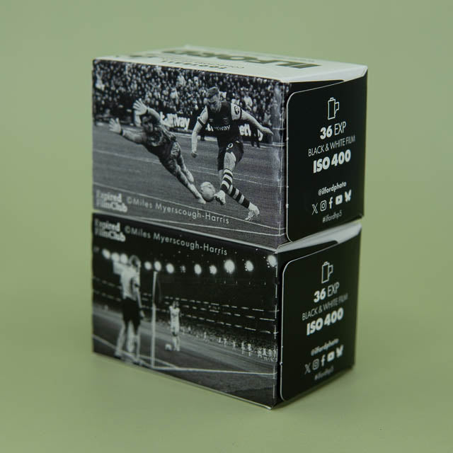 Two stacked card boxes with black and white sports images and photography-related text on a green background.