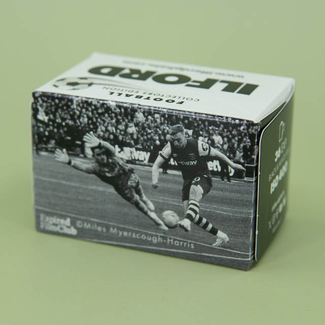 Film box with a soccer player design on a green background