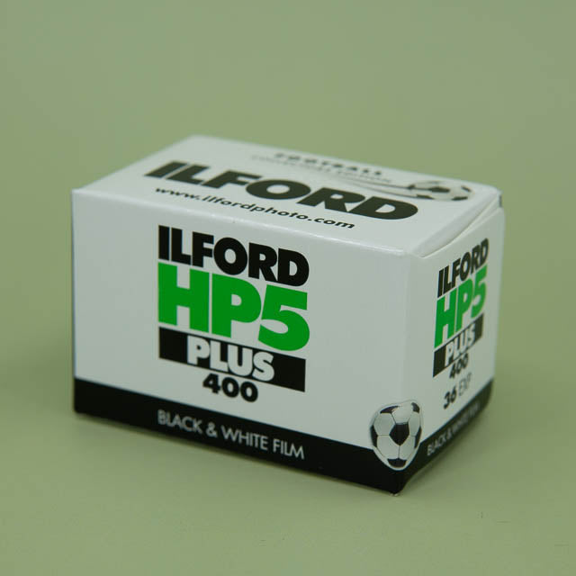 Ilford HP5 Plus 400 black and white film box on a green background