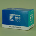 Kentmere Pan 100 black and white 35mm film box on a beige background