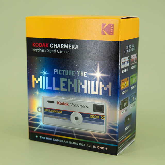 Kodak Charmera keychain digital camera packaging on a green background