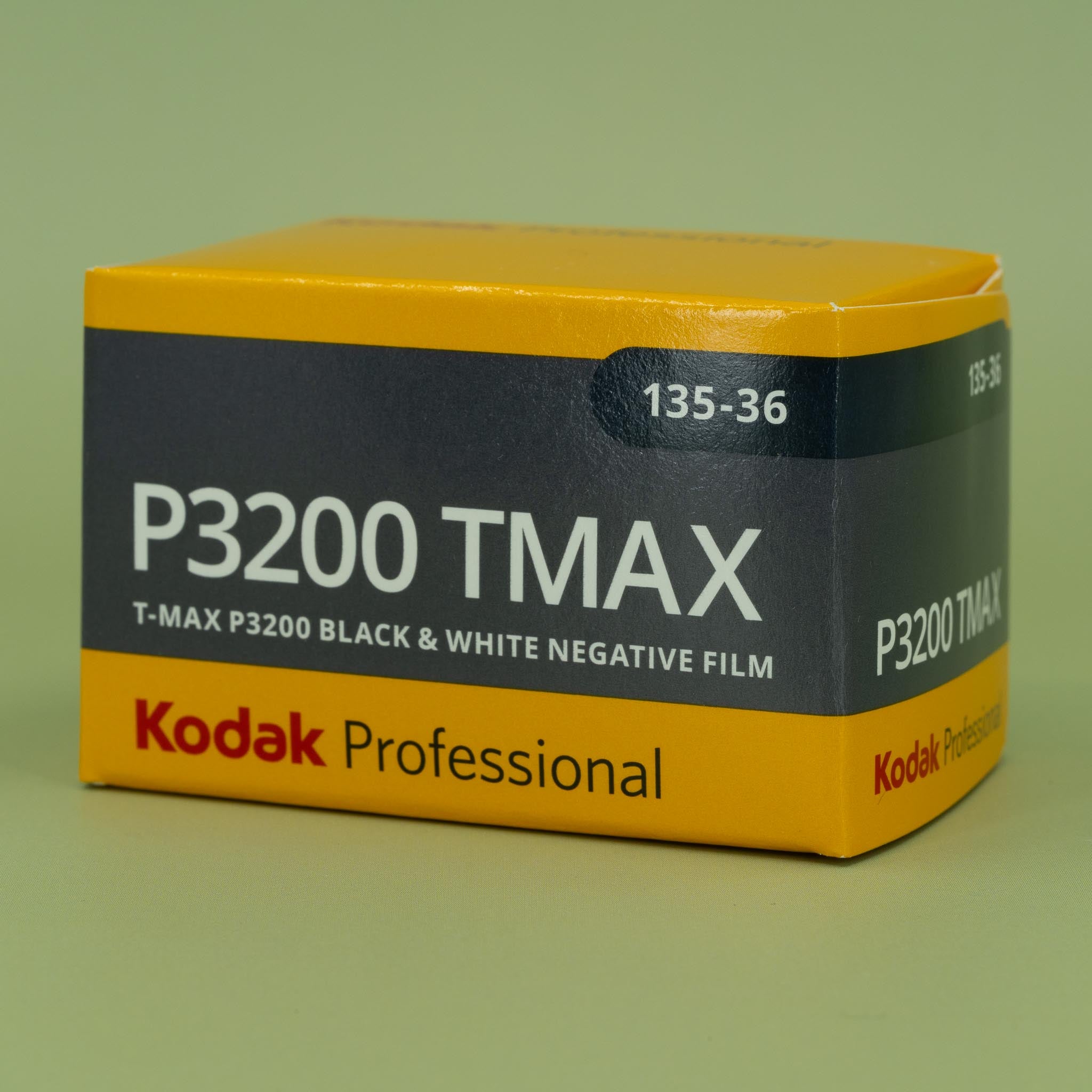 Kodak Professional P3200 TMAX black and white negative 35mm film box on a green background