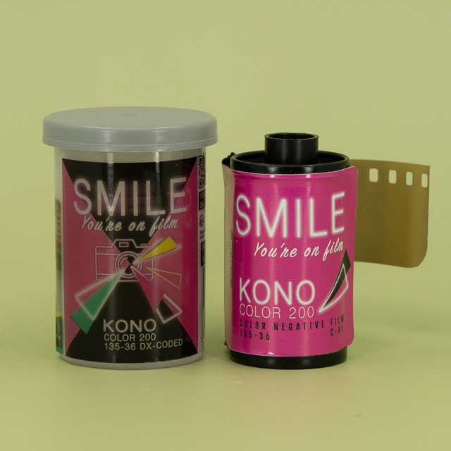 Two rolls of Kono smile color film on a green background