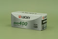 Lucky SHD400 120 black and white film box on a green background