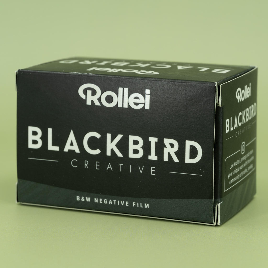 Rollei Blackbird Creative B&W Negative Film packaging on a green background