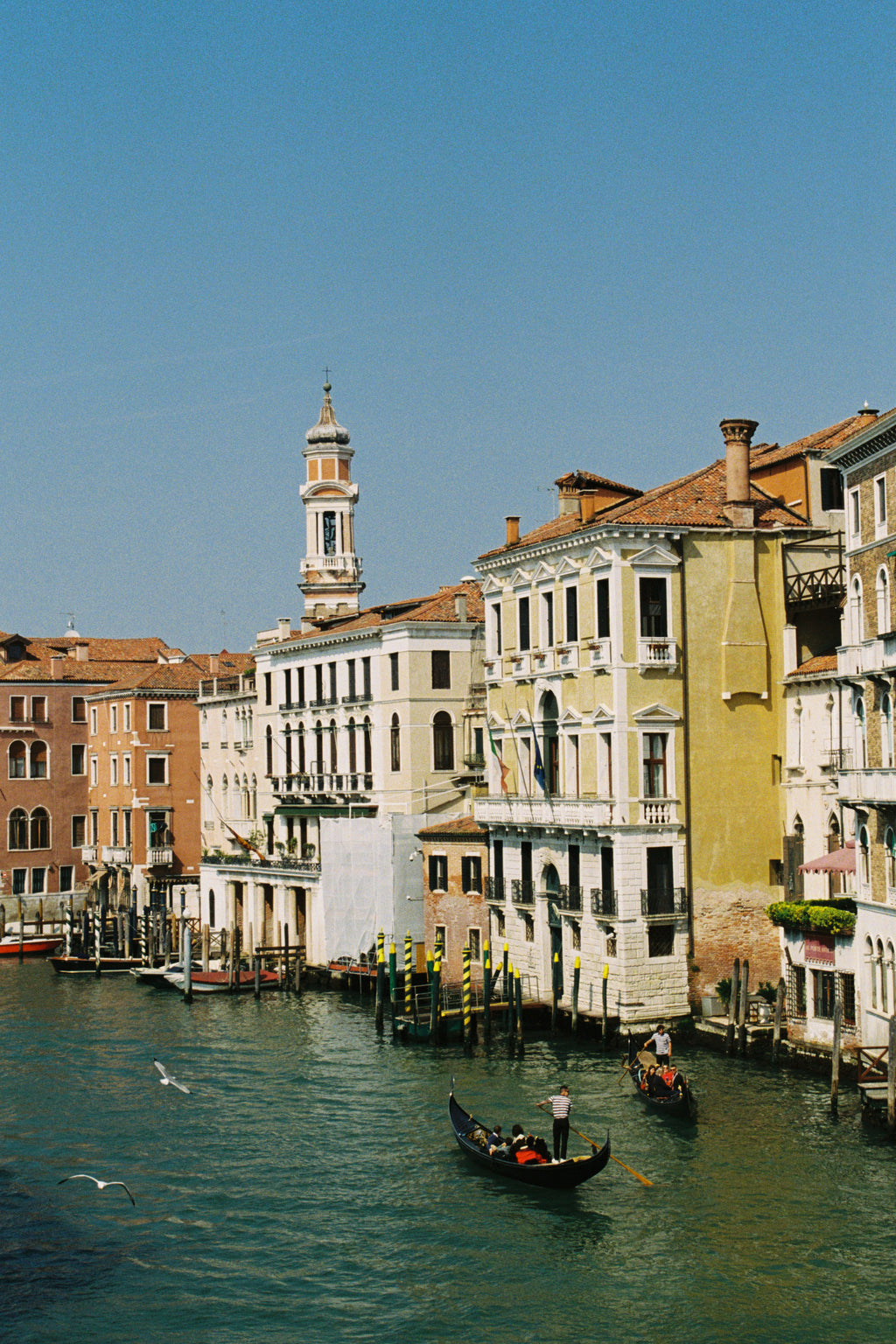 Venetian canal with gondolas and colorful buildings lining the water
