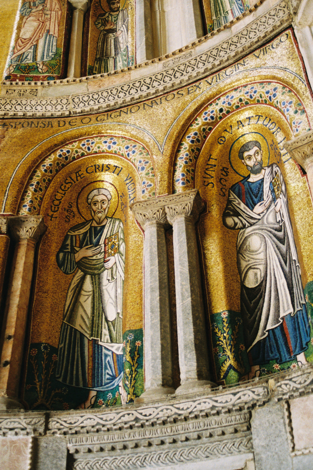 Decorative mosaic with religious figures in a cathedral setting