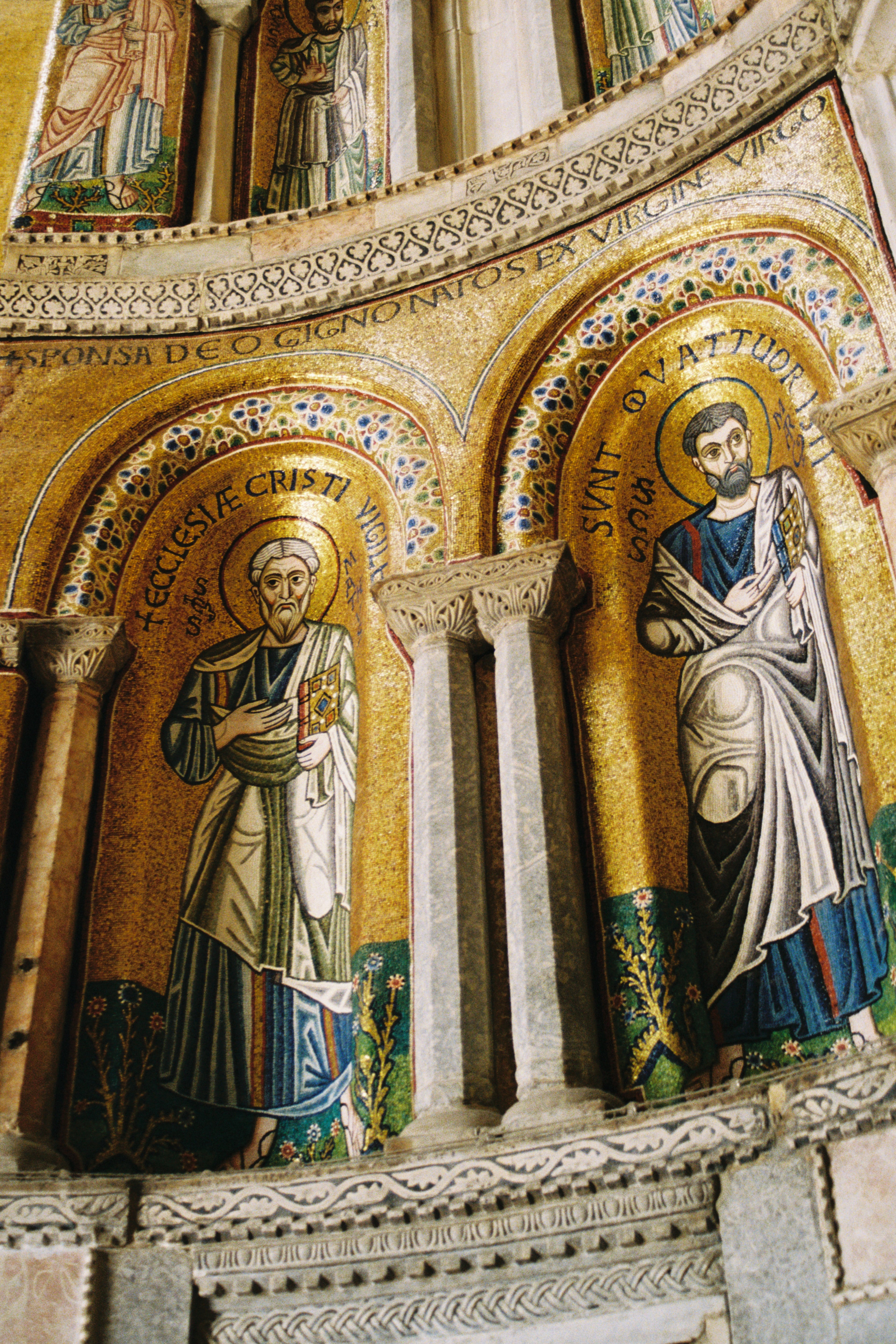 Decorative mosaic with religious figures in a cathedral setting